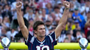 Tom Brady acknowledges his fans during a halftime celebration and the announcement of his induction in the the Patriots Hall of Fame.