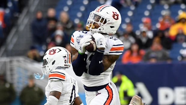 Auburn Tigers safety Caleb Wooden (12) intercepts a pass during the second half against the Maryland Terrapins