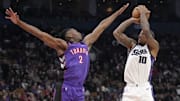 Nov 2, 2024; Toronto, Ontario, CAN; Toronto Raptors forward Jonathan Mogbo (2) tries to block a shot by Sacramento Kings forward DeMar DeRozan (10) during overtime at Scotiabank Arena. Mandatory Credit: John E. Sokolowski-Imagn Images