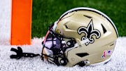Sep 8, 2024; New Orleans, Louisiana, USA;  Detailed view of the New Orleans Saints football helmet before the game against the Carolina Panthers during the pregame at Caesars Superdome. Mandatory Credit: Stephen Lew-Imagn Images