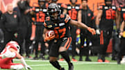 Jun 15, 2024; Vancouver, British Columbia, CAN;  BC Lions wide receiver Terry Williams (87) runs with the ball during the first half against the Calgary Stampeders at BC Place. Mandatory Credit: Simon Fearn-Imagn Images
