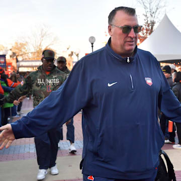 Nov 2, 2024; Champaign, Illinois, USA;  Illinois Fighting Illini head coach Bret Bielema gets a hand from the crowd before the start of a game with the Minnesota Golden Gophers at Memorial Stadium. Mandatory Credit: Ron Johnson-Imagn Images