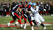 Nov 9, 2024; Montreal, Quebec, CAN; Montreal Alouettes quarterback Cody Fajardo (7) runs the ball against Toronto Argonauts defensive linesman Jake Ceresna (94) during the third quarter at Percival-Molson Memorial Stadium. Mandatory Credit: David Kirouac-Imagn Images