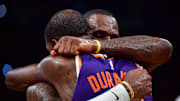 Oct 26, 2023; Los Angeles, California, USA; Phoenix Suns forward Kevin Durant (35) meets with Los Angeles Lakers forward LeBron James (23) following the game at Crypto.com Arena. Mandatory Credit: Gary A. Vasquez-Imagn Images