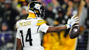 Former Pittsburgh Steelers receiver George Pickens celebrates a catch.