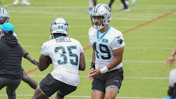 Jun 4, 2024; Charlotte, NC, USA; Carolina Panthers safety Clayton Isbell (35) and linebacker Jackson Mitchell (49) during OTAs. Mandatory Credit: Jim Dedmon-Imagn Images