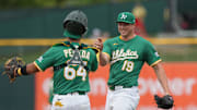 Jun 8, 2025; West Sacramento, California, USA; Athletics pitcher Mason Miller (19) celebrates with catcher Jhonny Pereda (64) after defeating the Baltimore Orioles at Sutter Health Park. Mandatory Credit: Darren Yamashita-Imagn Images