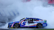 Oct 13, 2024; Concord, North Carolina, USA; NASCAR Cup Series driver Kyle Larson (5) celebrates after winning the Bank of America ROVAL 400 at Charlotte Motor Speedway Road Course. Mandatory Credit: Peter Casey-Imagn Images