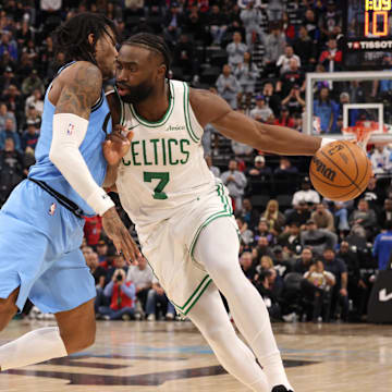 Jan 22, 2025; Inglewood, California, USA; Boston Celtics guard Jaylen Brown (7) drives against LA Clippers guard Kevin Porter Jr. (77) during the fourth quarter at Intuit Dome. Mandatory Credit: Jason Parkhurst-Imagn Images