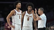  Desmond Claude (1) and guard Wesley Yates III (6) listen to direction s from their former coach, USC's Eric Musselman. 
